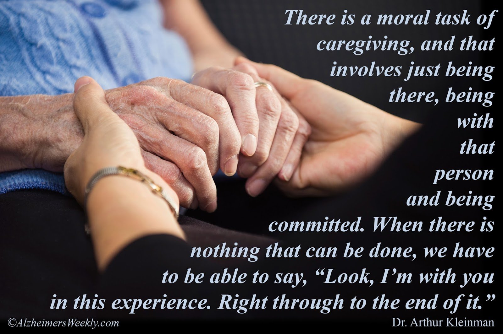 Holding the hands of a person with dementia