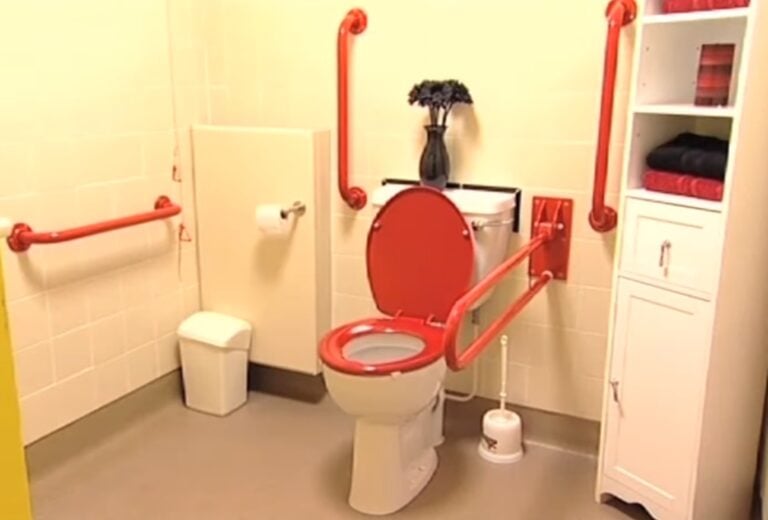 White Bathroom with Red Enhancements for Dementia
