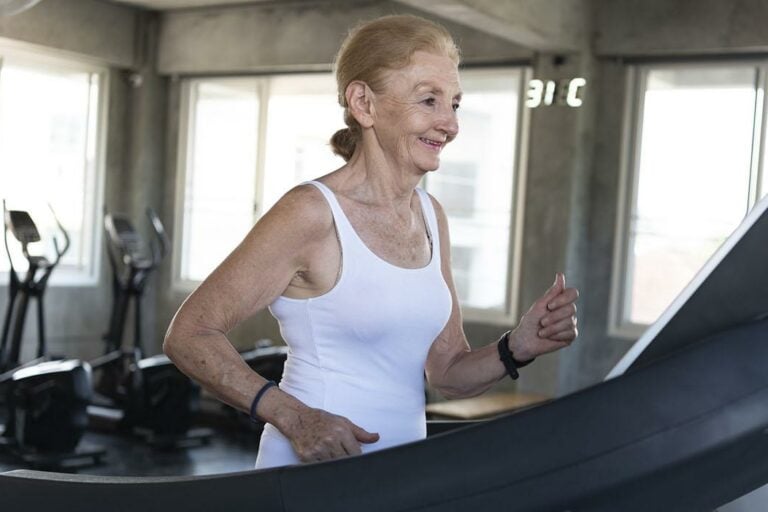 Elder woman exercising on treadmill