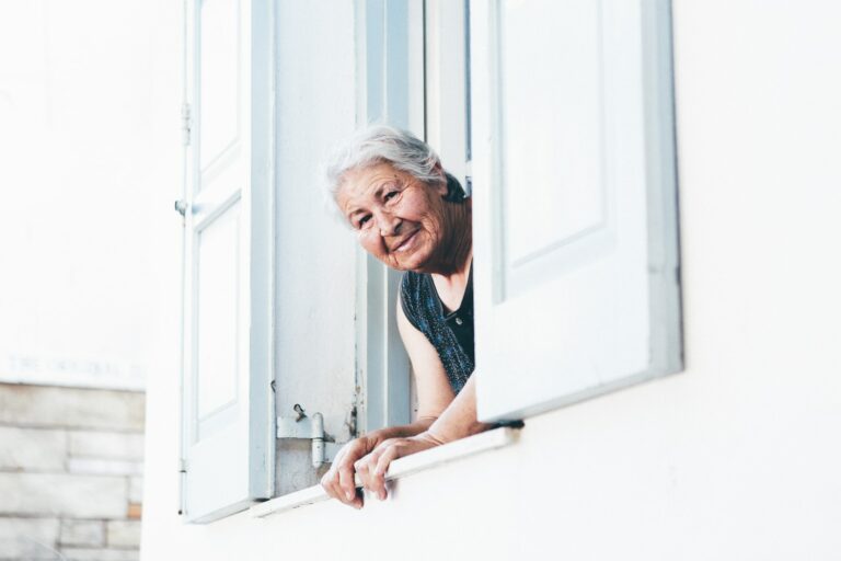 elder woman peeping at window
