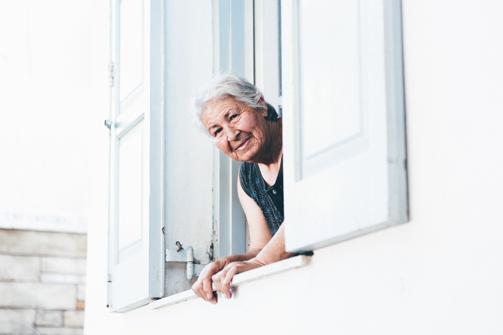 elder woman peeping at window