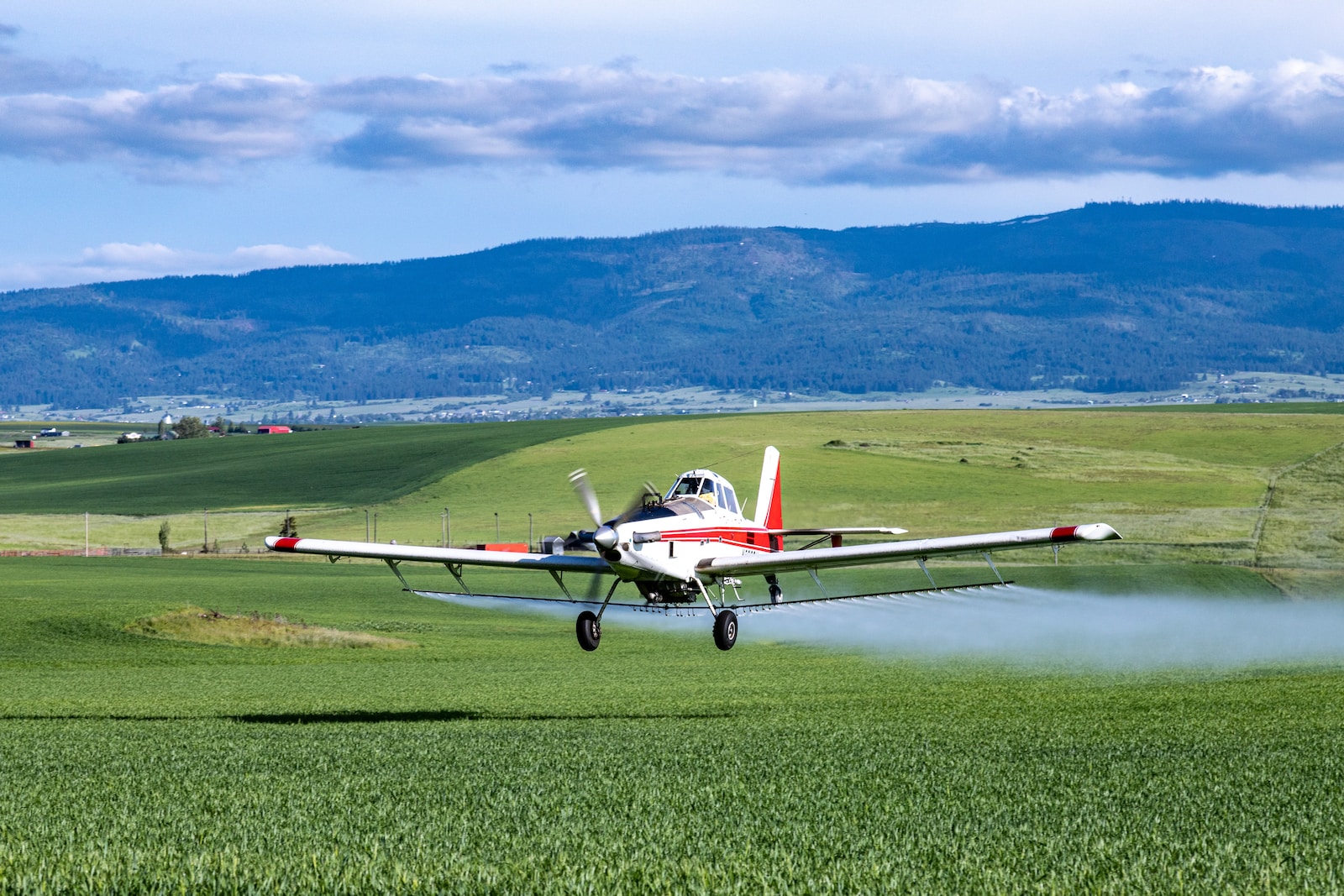 small airplane spreading pesticide