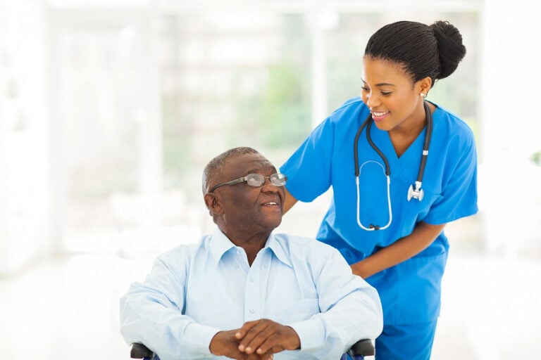 Nurse checking with an Alzheimer's caregiver