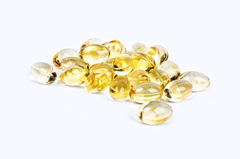 vitamin d pill, yellow, isolated
