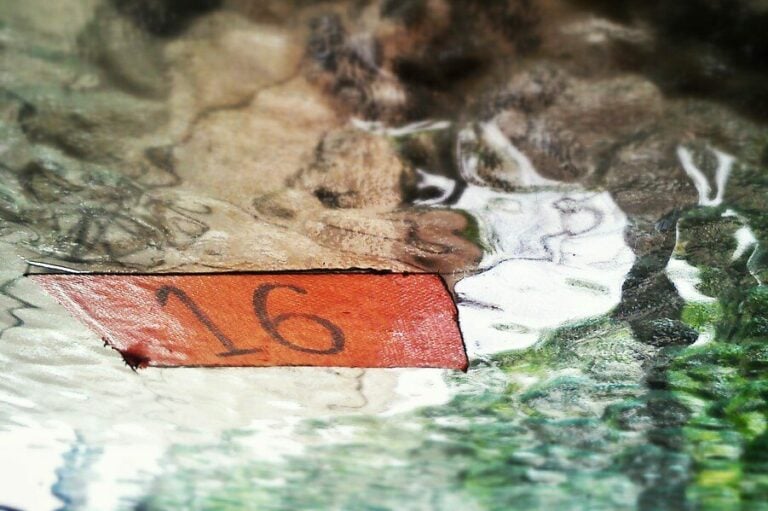 The number Sixteen floating on water