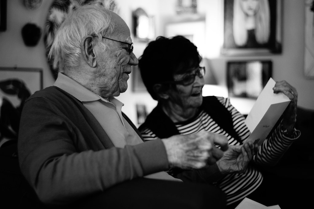 Grandma reading to grandpa 