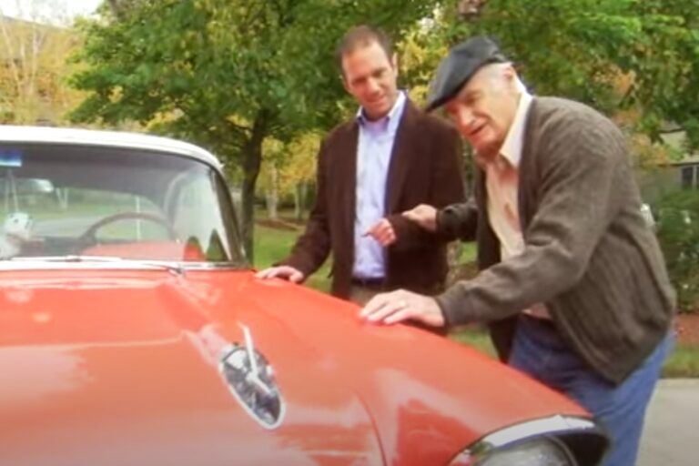 Elder father, son and their classic car