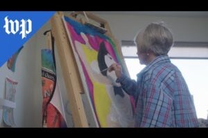 Rebecca painting her artwork