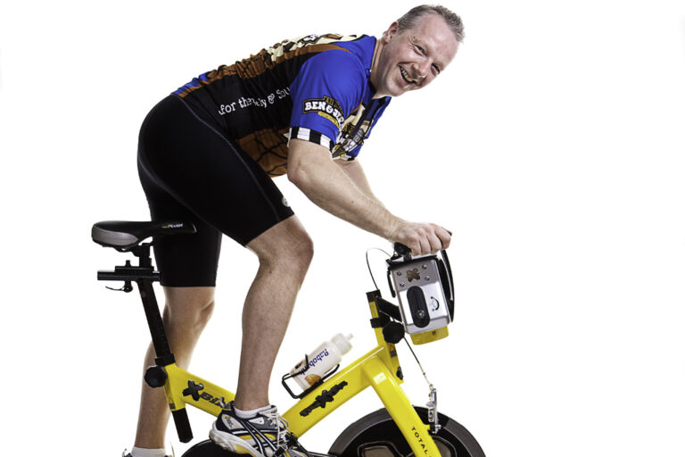 Elder man on exercise bike