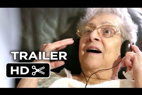 Elderly woman listening to music on headphones
